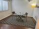 Cozy dining area with a modern table set and natural light from the window at 7902 Benjamin Dr, Lawrence, IN 46226