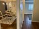 Dining room with round table and chairs and a view into the hallway at 7902 Benjamin Dr, Lawrence, IN 46226