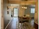 Bright dining room with a round table and chairs under pendant lighting at 7902 Benjamin Dr, Lawrence, IN 46226