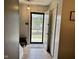 Inviting entryway featuring tile flooring, a coat closet, and neutral decor at 7902 Benjamin Dr, Lawrence, IN 46226