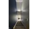 Stairway with modern lighting going down to a living area at 7902 Benjamin Dr, Lawrence, IN 46226