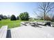 Backyard deck with a table and chairs, a grill, and a hot tub at 9921 N Wind River Run, McCordsville, IN 46055