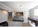 Finished basement featuring a gray sofa and a foosball table for entertainment at 9921 N Wind River Run, McCordsville, IN 46055