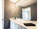 Gray bathroom featuring a well-lit vanity, white cabinets, and a full-size mirror at 9921 N Wind River Run, McCordsville, IN 46055