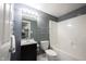 Bathroom featuring a modern sink, mirror, and shower-tub combo at 9921 N Wind River Run, McCordsville, IN 46055