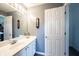Bathroom with a white vanity, brushed nickel fixtures, and a vintage clock providing timeless appeal at 9921 N Wind River Run, McCordsville, IN 46055