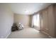 Cozy bedroom with a chair and side table, bright natural light from a large window and neutral decor at 9921 N Wind River Run, McCordsville, IN 46055