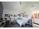 Bright bedroom featuring a ceiling fan, desk, and an en suite bathroom at 9921 N Wind River Run, McCordsville, IN 46055