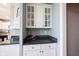 The kitchen features white cabinets, granite counters, and a bar area at 9921 N Wind River Run, McCordsville, IN 46055