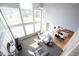 Bright, open-concept living room with soaring ceilings, large windows and modern, comfortable furniture at 9921 N Wind River Run, McCordsville, IN 46055