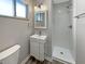 Bathroom featuring a modern vanity and a walk-in shower with white tile at 10225 Bayton Ct, Indianapolis, IN 46229