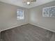 Bedroom with ceiling fan, neutral carpet, natural light, and neutral grey walls at 10225 Bayton Ct, Indianapolis, IN 46229