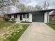 Charming single-story home featuring a paved driveway and freshly painted exterior at 10225 Bayton Ct, Indianapolis, IN 46229