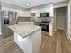 Bright kitchen featuring granite countertops, stainless steel appliances, a kitchen island and hardwood floors at 10225 Bayton Ct, Indianapolis, IN 46229