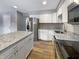 Updated kitchen featuring granite countertops and modern stainless steel appliances at 10225 Bayton Ct, Indianapolis, IN 46229
