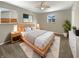 Cozy main bedroom features a neutral color palette, stylish furnishings and a large bed at 10225 Bayton Ct, Indianapolis, IN 46229