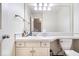 Clean bathroom with a sink, toilet, and a large mirror at 10249 Southwind Dr, Indianapolis, IN 46256