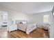 Main bedroom featuring hardwood floors, lots of natural light, and a bathroom doorway at 10249 Southwind Dr, Indianapolis, IN 46256