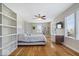 Bright bedroom with hardwood floors, built-in shelving, and ample natural light at 10249 Southwind Dr, Indianapolis, IN 46256