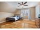 Bedroom with hardwood flooring, a ceiling fan, and natural lighting at 10249 Southwind Dr, Indianapolis, IN 46256