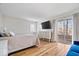 Spacious bedroom featuring hardwood floors, large windows, and sliding glass door at 10249 Southwind Dr, Indianapolis, IN 46256
