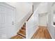 Welcoming entryway features hardwood floors, wooden stairs and decorative trim at 10249 Southwind Dr, Indianapolis, IN 46256