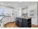 Clean kitchen with white cabinets, an island, and stainless steel appliances at 10249 Southwind Dr, Indianapolis, IN 46256