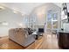 Bright living room featuring a fireplace, hardwood floors, and large windows at 10249 Southwind Dr, Indianapolis, IN 46256