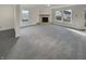 Bright living room with a stone fireplace and neutral carpet at 10291 Buckshire Ln, Indianapolis, IN 46234