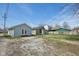 View of the backyard and the blue home with french doors from the back at 1039 S Ohio St, Martinsville, IN 46151