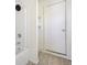 Cozy bathroom featuring a tub/shower combination, toilet and small shelves at 1039 S Ohio St, Martinsville, IN 46151