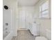 Well-lit bathroom with a tub and shower, modern vanity, and a window offering natural light at 1039 S Ohio St, Martinsville, IN 46151