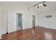 Bedroom featuring hardwood floors and a glimpse into the bathroom and another room at 1039 S Ohio St, Martinsville, IN 46151