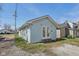Side view of a light blue home with white framed french doors leading to the backyard at 1039 S Ohio St, Martinsville, IN 46151