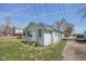 View of the exterior showing the house's side profile with a driveway at 1039 S Ohio St, Martinsville, IN 46151