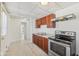 Kitchen with neutral countertops, wooden cabinets, and modern appliances including a stainless steel stove at 1039 S Ohio St, Martinsville, IN 46151