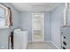 Laundry room includes a washing machine, furnace and window offering natural light, enhancing functionality at 1039 S Ohio St, Martinsville, IN 46151