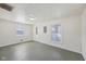 Living room with painted floor, new windows, and freshly painted walls at 1039 S Ohio St, Martinsville, IN 46151