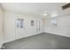 Living room with painted floor, new windows, and freshly painted walls at 1039 S Ohio St, Martinsville, IN 46151
