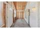 Enclosed porch with exposed wood accents, creating a rustic feel with natural light and a doorway at 1039 S Ohio St, Martinsville, IN 46151