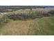 Aerial view of a lot with scattered trees and a pond at 10624 N 200 W, Alexandria, IN 46001