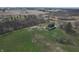 Aerial view features an expansive field with a barn and farm houses at 10624 N 200 W, Alexandria, IN 46001