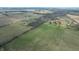 Aerial view of land with a long driveway leading to buildings in the distance at 10624 N 200 W, Alexandria, IN 46001