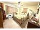 Cozy bedroom featuring a ceiling fan and neutral tones throughout at 10624 N 200 W, Alexandria, IN 46001