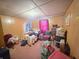 Cozy room with a wood paneled walls, and personal items at 10624 N 200 W, Alexandria, IN 46001