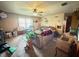 Comfortable living room with cozy seating, a ceiling fan, and natural light at 10624 N 200 W, Alexandria, IN 46001
