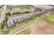 Panoramic aerial view of homes beside a golf course, highlighting the well-maintained community at 10744 Eldorado Cir, Noblesville, IN 46060