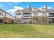 Spacious backyard showcasing the home's private outdoor living space and stone facade at 10744 Eldorado Cir, Noblesville, IN 46060