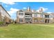 Spacious backyard showcasing the home's private outdoor living space and stone facade at 10744 Eldorado Cir, Noblesville, IN 46060