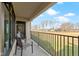 Relaxing balcony with comfortable seating and views of the well-maintained golf course and natural landscape at 10744 Eldorado Cir, Noblesville, IN 46060